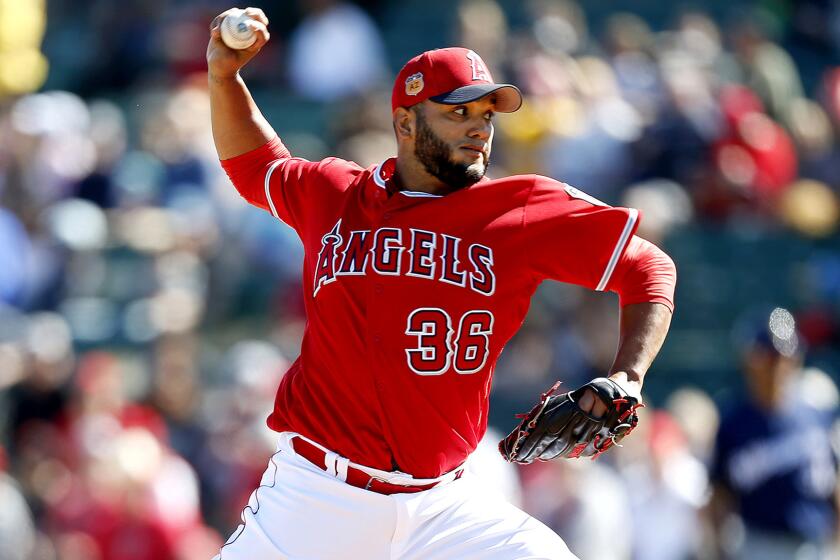 TEMPE, ARIZ. -- SATURDAY, FEBRUARY 25, 2017: Los Angeles Angels pitcher Yusmeiro Petit (36) delivers a pitch in a spring training game against the Milwaukee Brewers at Tempe Diablo stadium in Tempe, Ariz., on Feb. 25, 2017. (Gary Coronado / Los Angeles Times)