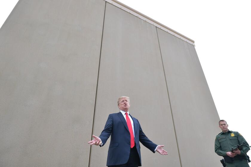 President Trump inspects proposed border wall prototypes near San Diego on March 13.