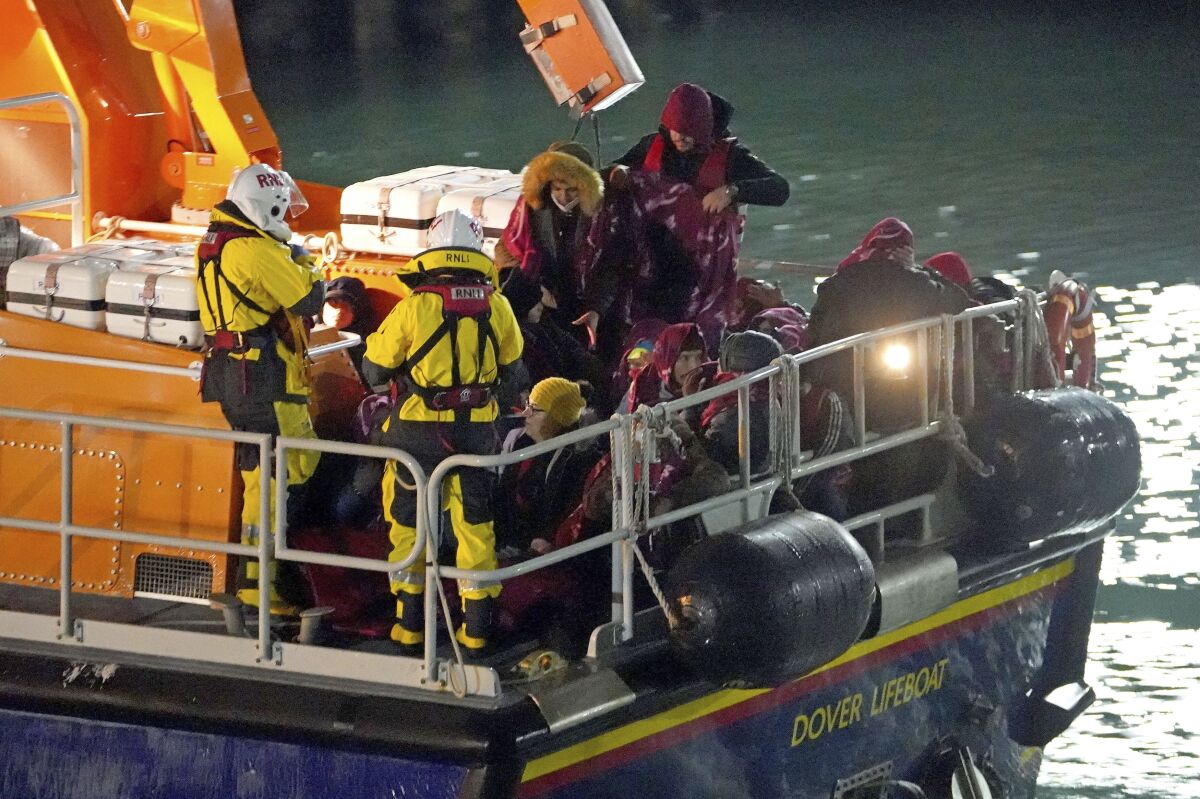 A group of people thought to be migrants are brought in to Dover, England, by the Royal National Lifeboat Institution