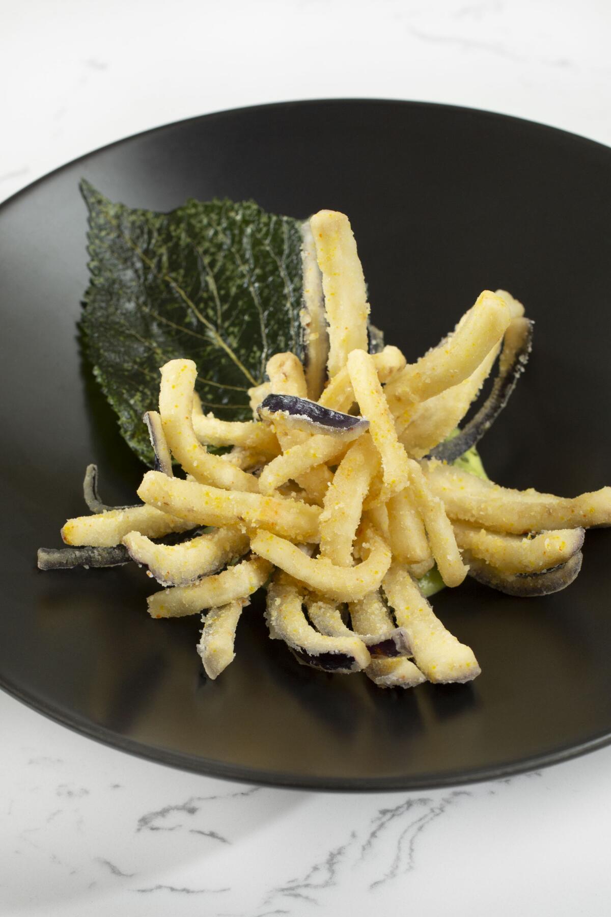 Eggplant served with aji verde and crispy shiso leaf at Taste of Beauty.