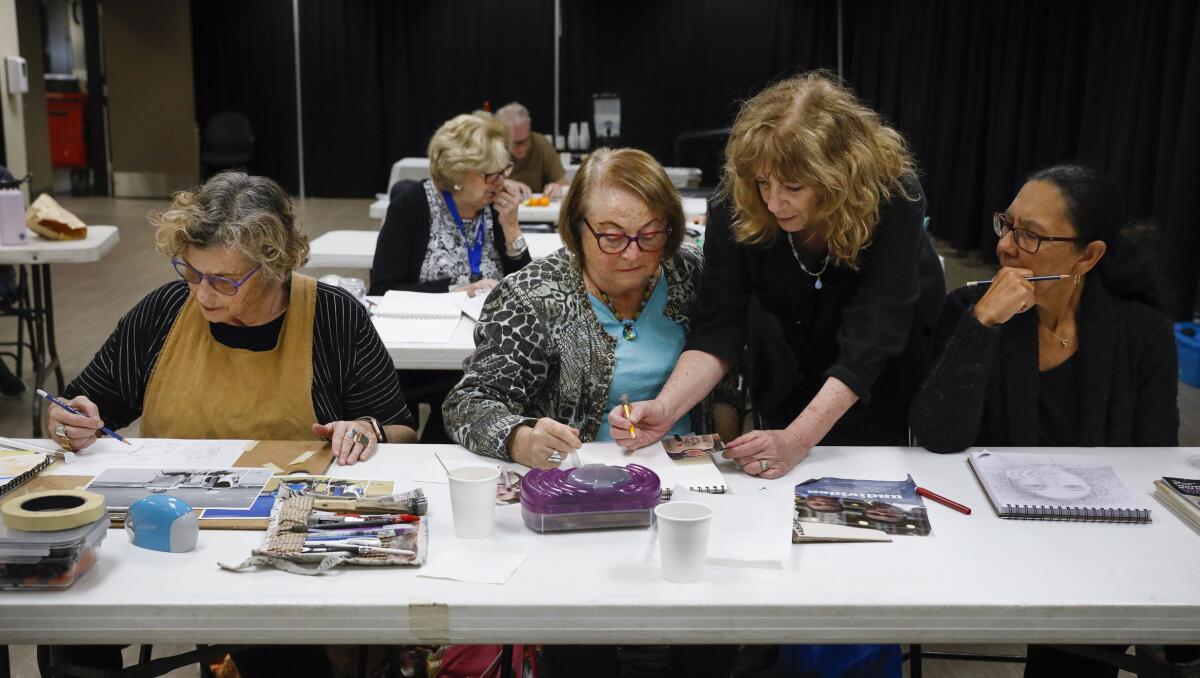 Neta Bourdas, Frida Grossman, instructor Renee Corwin and Rene McDaniel attend a basic drawing class at the JCC.