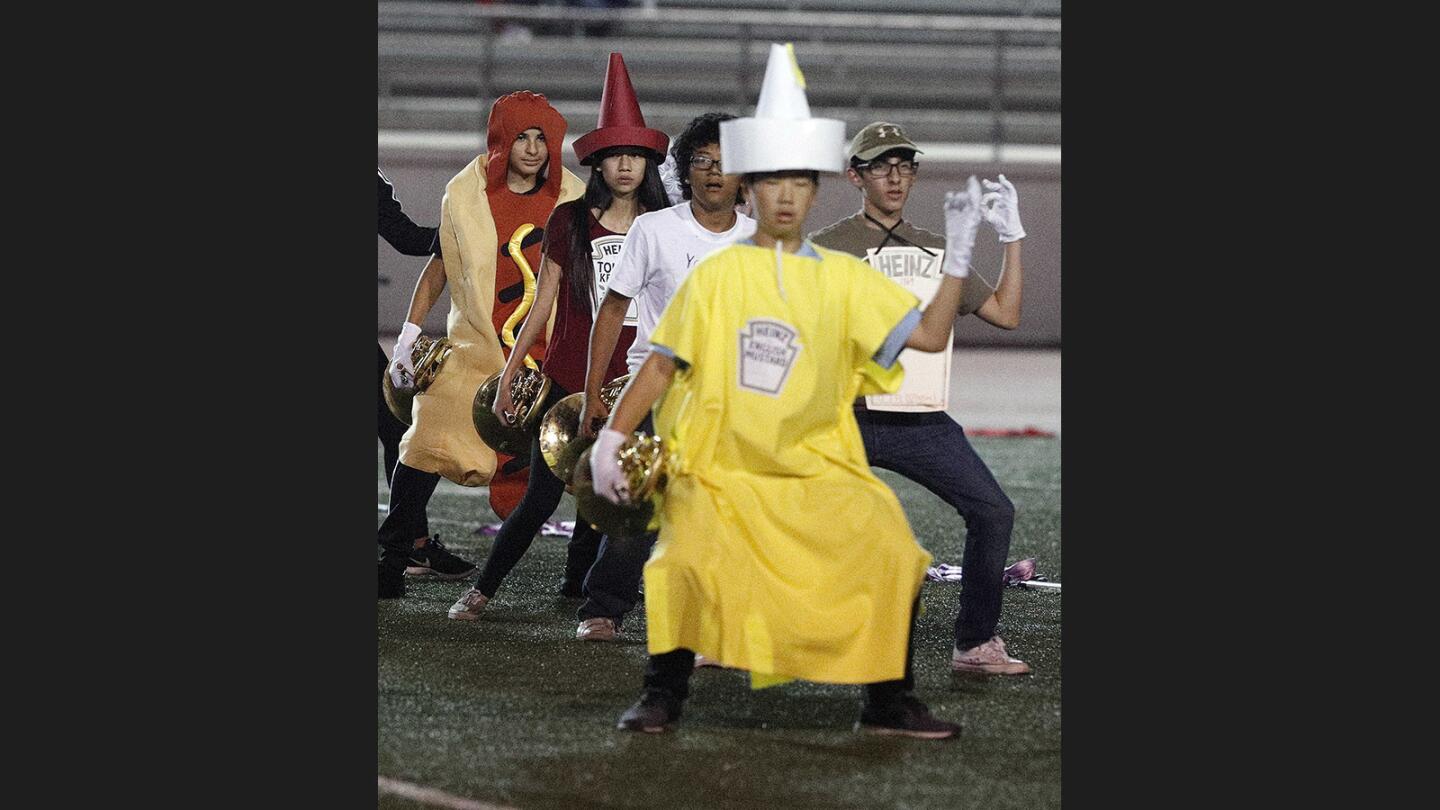Photo Gallery: Crescenta Valley vs. Glendale in Pacific League football and the Crescenta Valley marching band takes the field in Halloween costumes