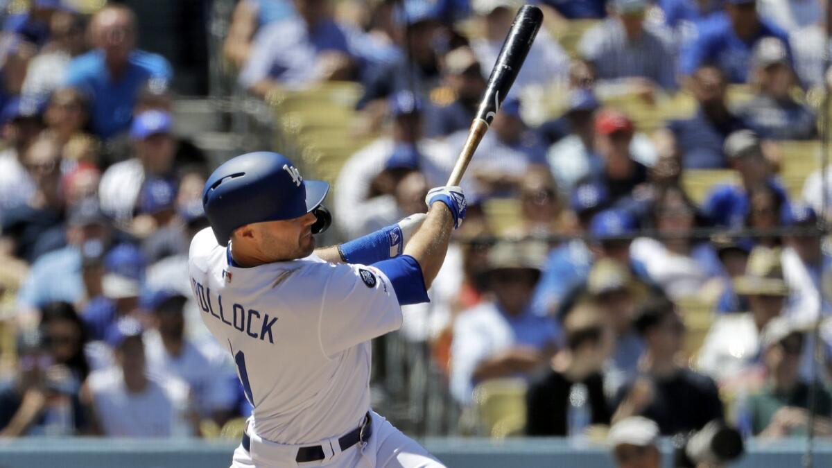 Dodgers’ A.J. Pollock hits a three-run home run off Cincinnati Reds starting pitcher Sonny Gray during the sixth inning on Wednesday at Dodger Stadium.