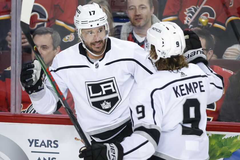Los Angeles Kings' Ilya Kovalchuk, left, celebrates his goal with Adrian Kempe during the second period of an NHL hockey game against the Calgary Flames on Tuesday, Oct. 8, 2019, in Calgary, Alberta. (Jeff McIntosh/The Canadian Press via AP)