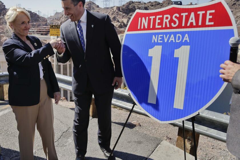 Republican Gov. Brian Sandoval of Nevada, pictured with Arizona Gov. Jan Brewer, has thrown cold water on the prospect of challenging Democratic Senate Majority Leader Harry Reid. But he won't rule it out entirely.