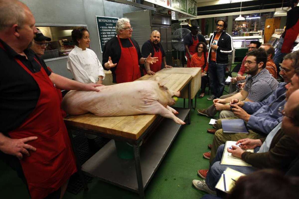 Butcher Bob Ore, from left, Dan Vance, Jar chef Suzanne Tracht, Jim Cascone and butcher John Escobedo conduct a meat cutting and cooking class at Huntington Meats.