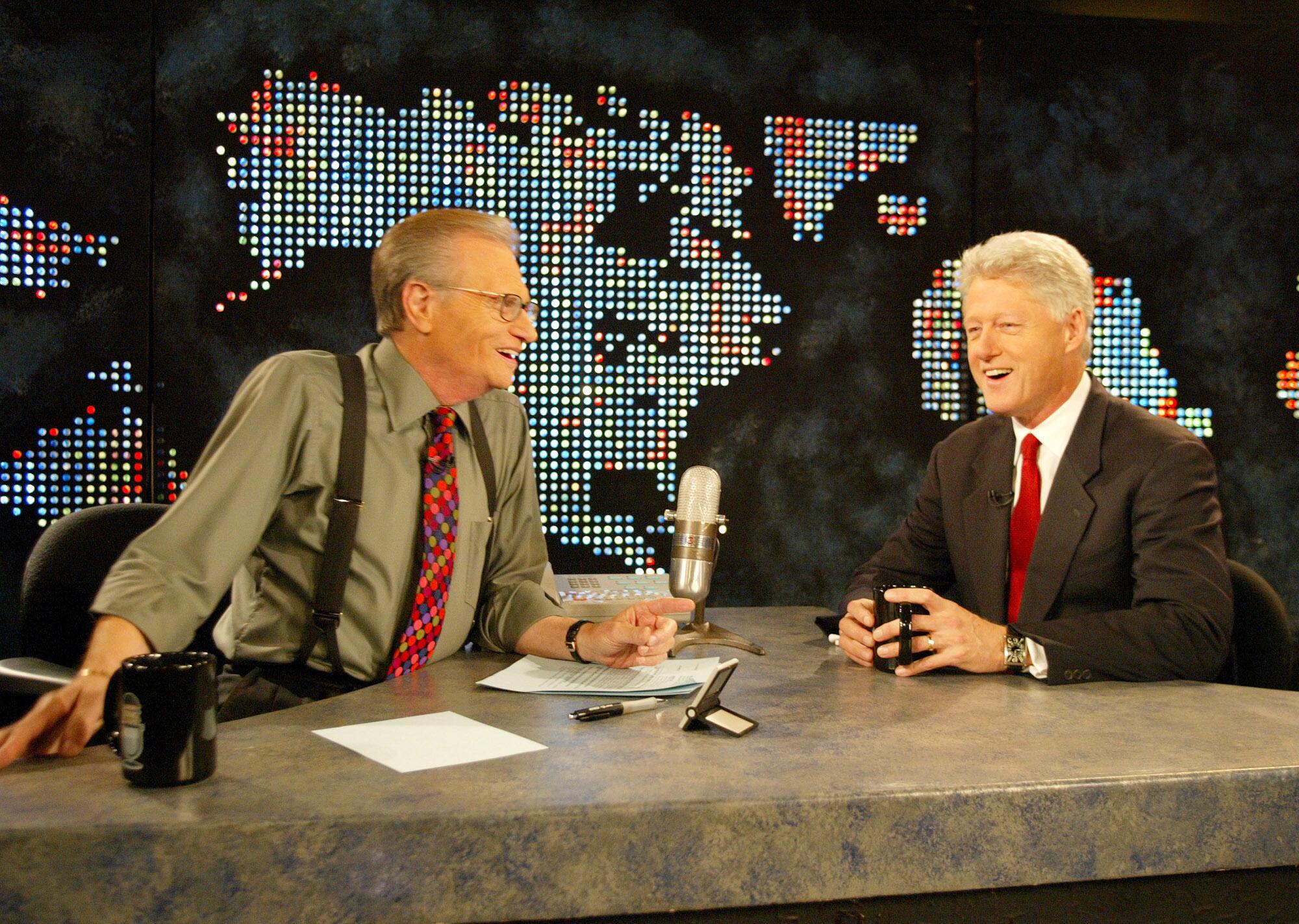 Larry King interviews former President Clinton in 2002.
