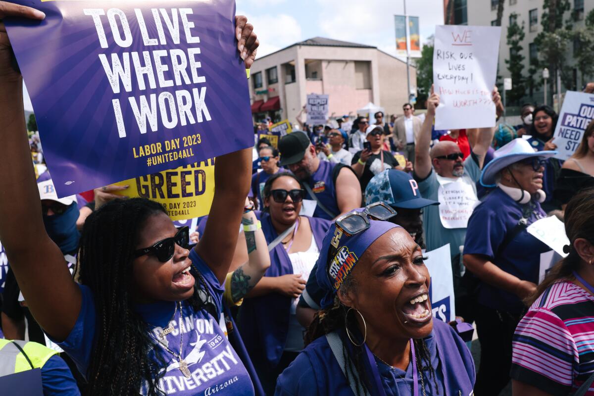 Thousands of healthcare workers march at a union rally at Kaiser Permanente Los Angeles Medical Center in Hollywood.