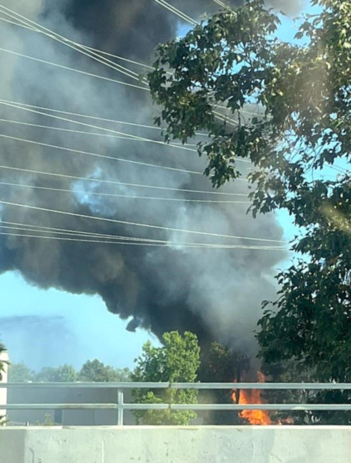 Flames and smoke from a structure fire in Costa Mesa Sunday were visible from near the 405 freeway.