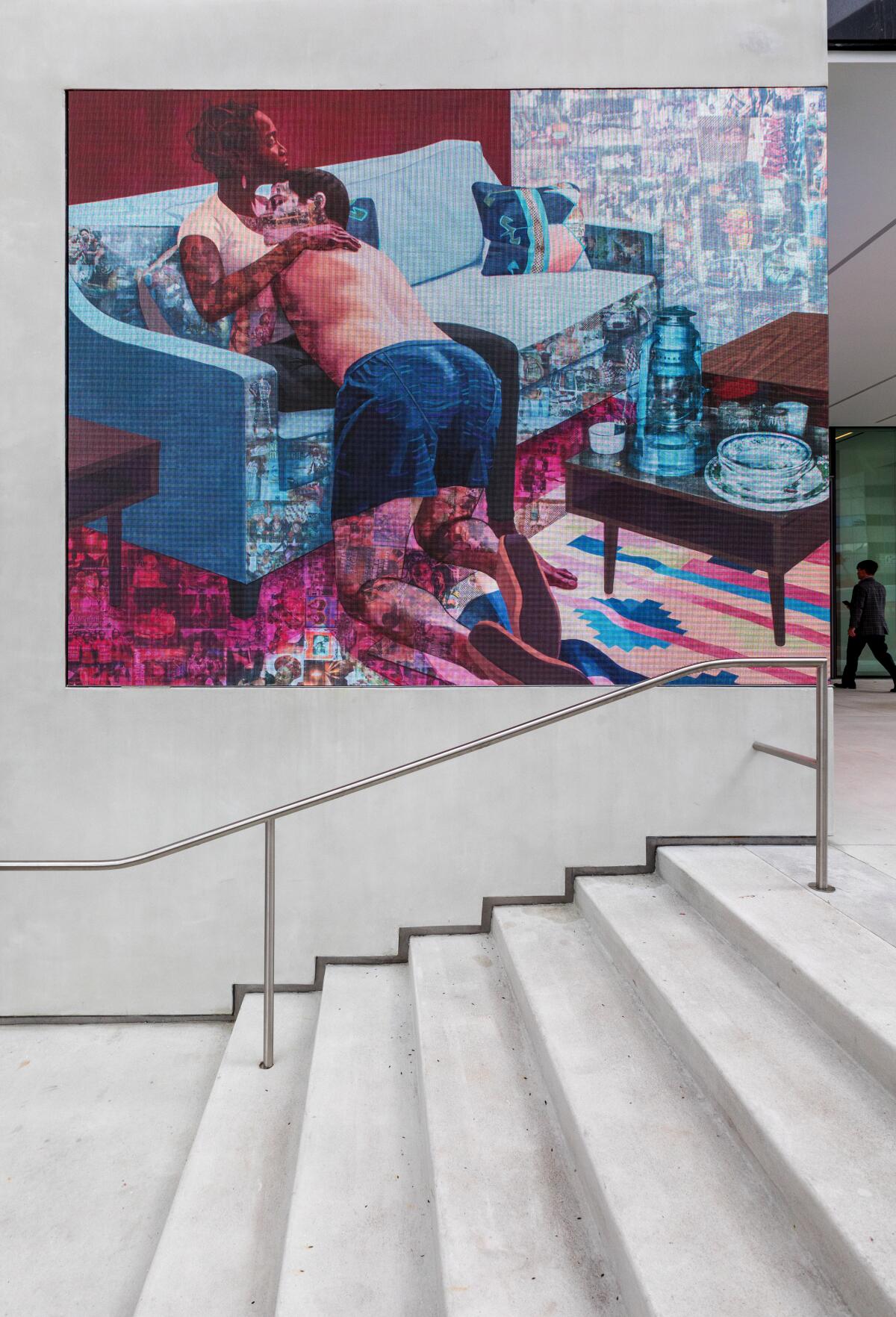 A mural beside the Hammer Museum entrance depicts two people embracing.