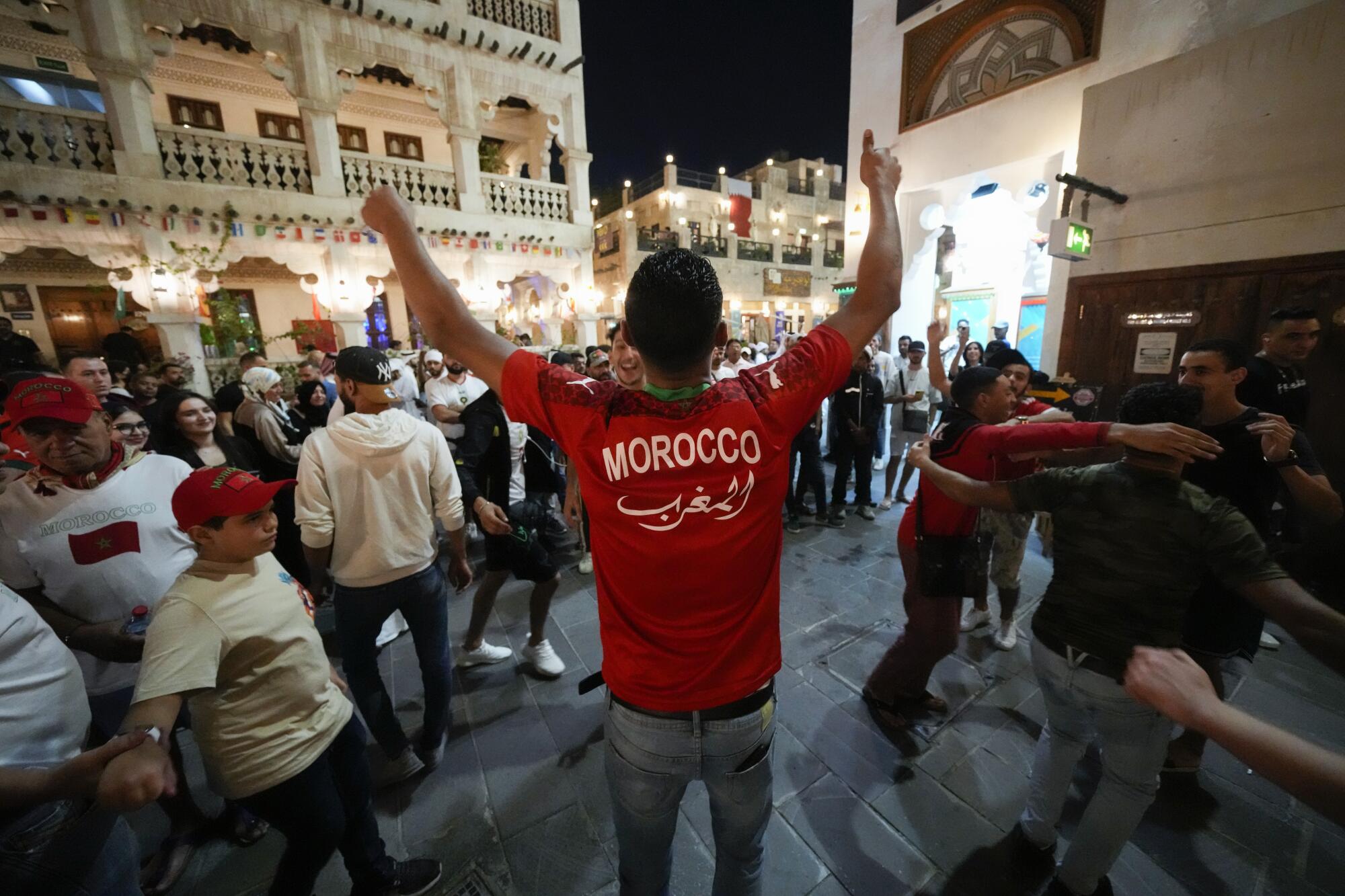 Moroccan soccer fans dance at the S 