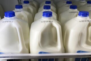 FILE - Milk is displayed at a grocery store in Philadelphia, Tuesday, July 12, 2022. Food and Drug Administration officials issued guidance that says plant-based beverages don’t pretend to be from dairy animals – and that U.S. consumers aren’t confused by the difference. (AP Photo/Matt Rourke, File)