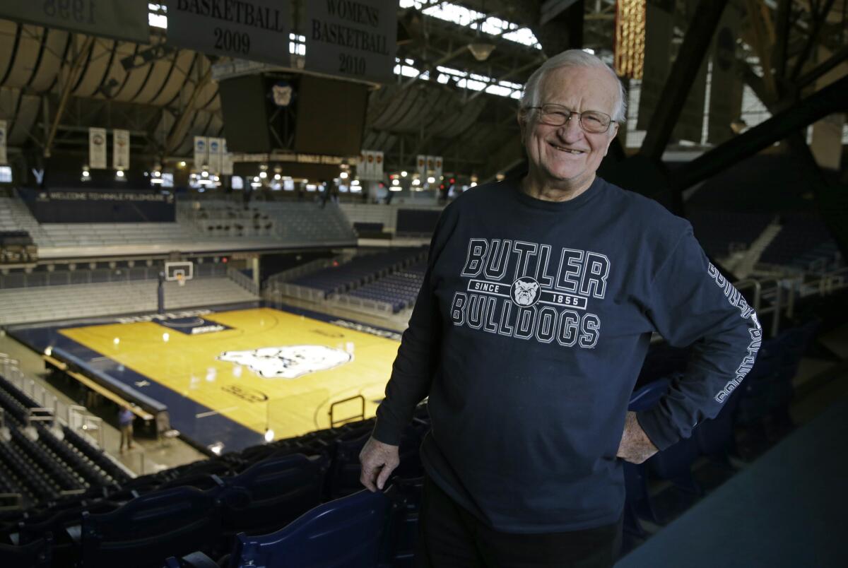 FILE - In this Dec. 20, 2016, file photo, Bobby Plump, star of the 1954 Milan state championship basketball team, poses at Hinkle Fieldhouse in Indianapolis. “The Indiana high school tournament is still special, not as special as it used to be, but it’s still special," said Plump, whose winning shot in the 1954 state championship game became the inspiration for “Hoosiers." (AP Photo/Michael Conroy, File)