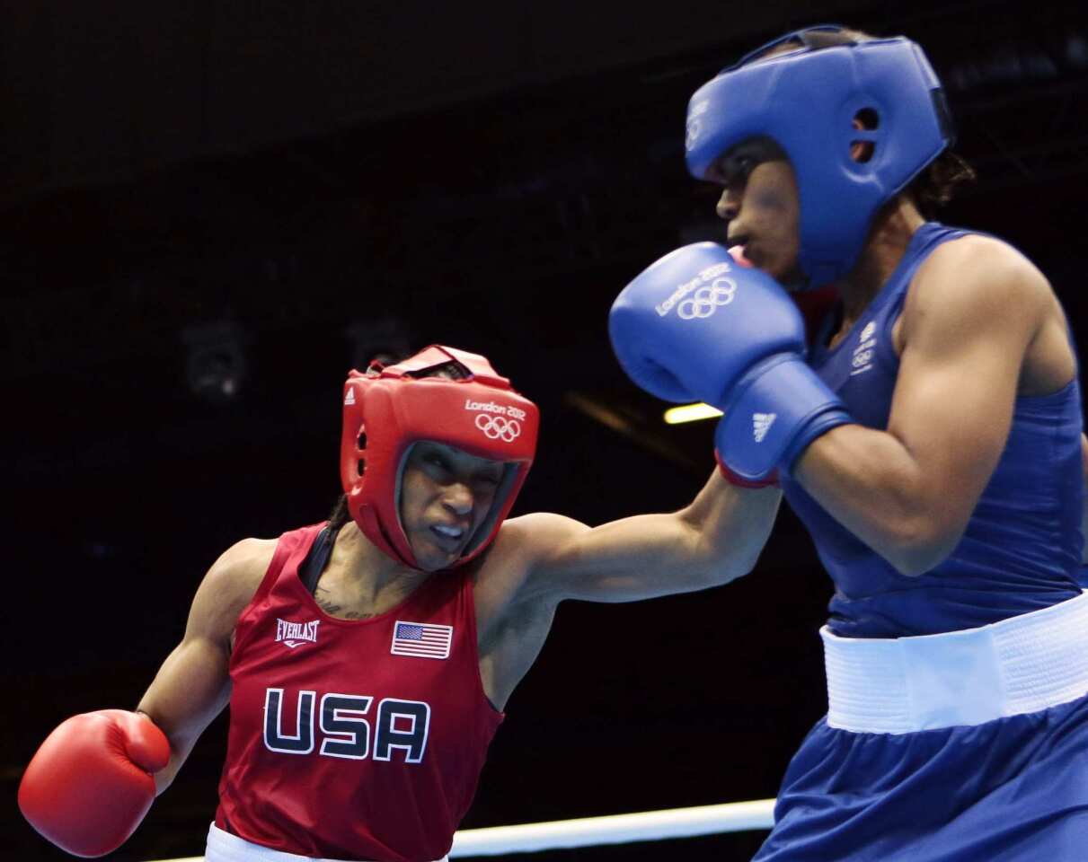 Team USA's Quanitta Underwood, whose fans know her as Queen, and Natasha Jonas of Great Britain fight during the women's lightweight boxing competition.