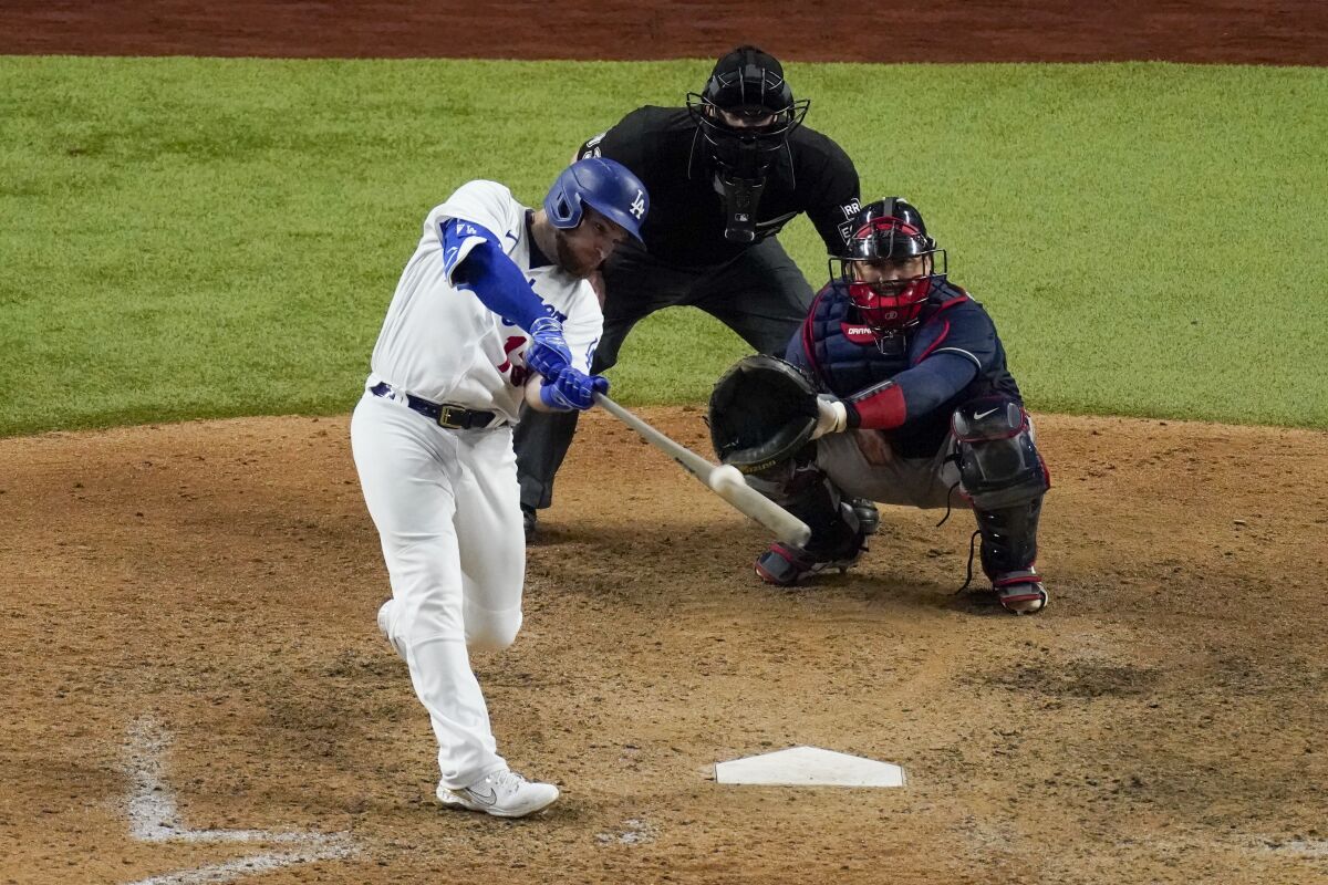 Dodgers first baseman Max Muncy hits a two-run home run against the Atlanta Braves.