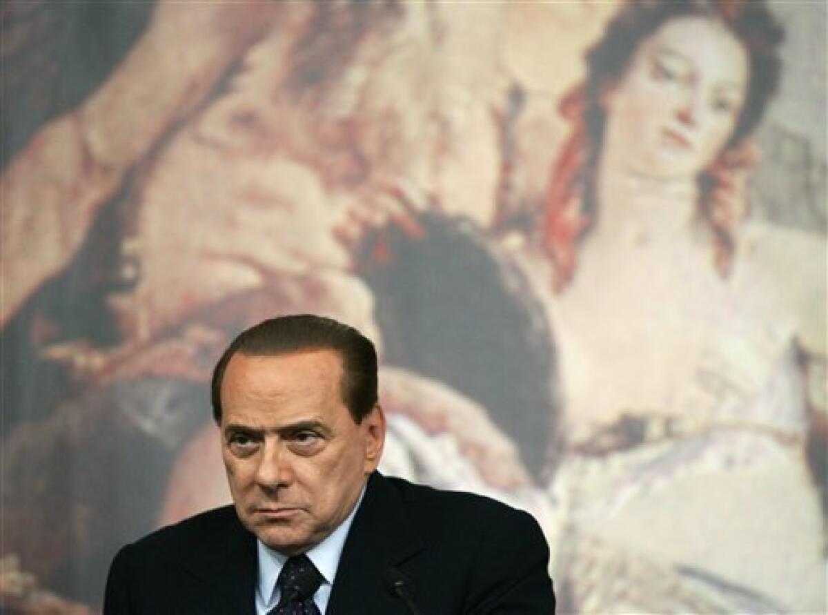 Italian Premier Silvio Berlusconi listens to a reporter's question during a press conference at the Chigi Premier's palace, in Rome, Wednesday, Feb. 16, 2011. Berlusconi says he is not worried by an impending prostitution trial, in his first public comments since he was indicted. The 74-year-old Italian leader was ordered Tuesday to stand trial on charges he paid a 17-year-old Moroccan girl for sex, and then used his influence to cover it up. (AP Photo/Riccardo De Luca)