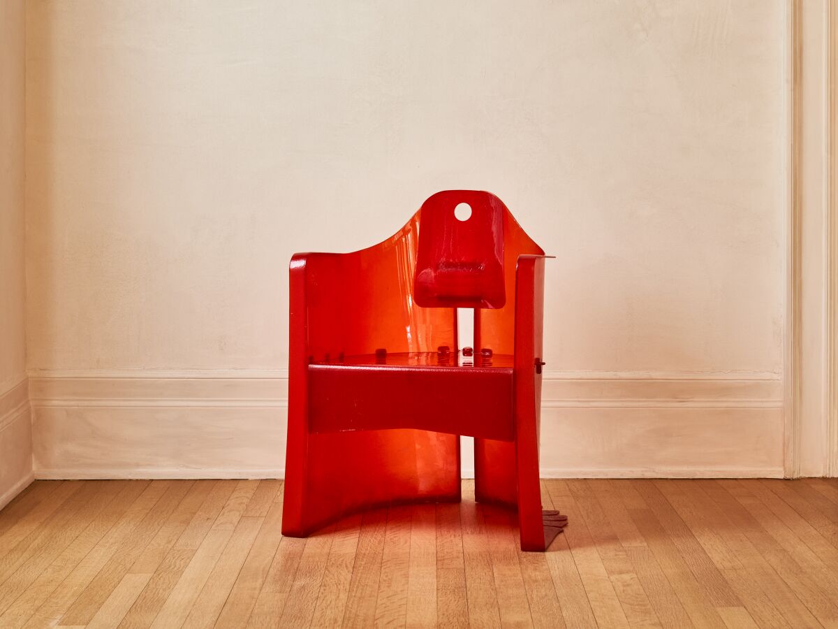 A  translucent red chair