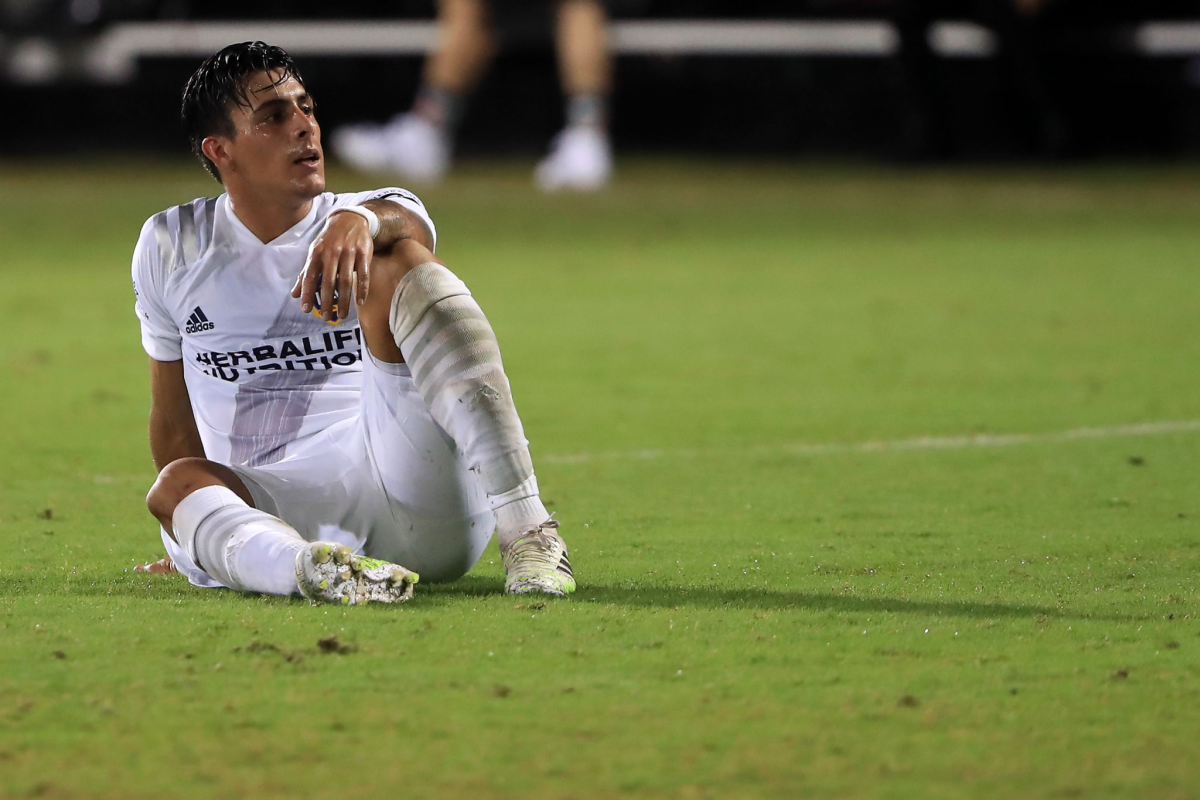 Cristian Pavón looks dejected after a match between Galaxy and Houston Dynamo.