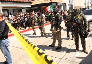 Residents confront ICE agents and Border Patrol agents as residents scream