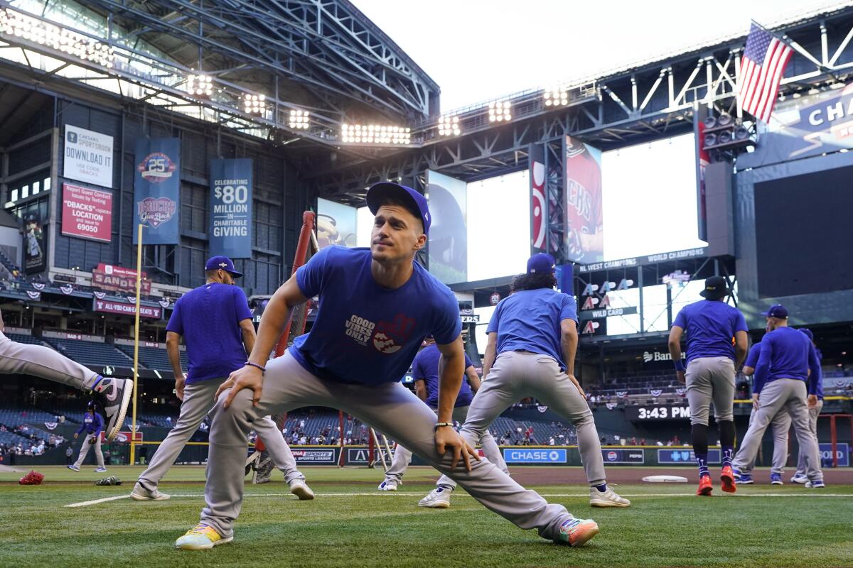 Kiké Hernández stretches before Game 3 of the NLDS against the Arizona Diamondbacks at Chase Field in Phoenix.