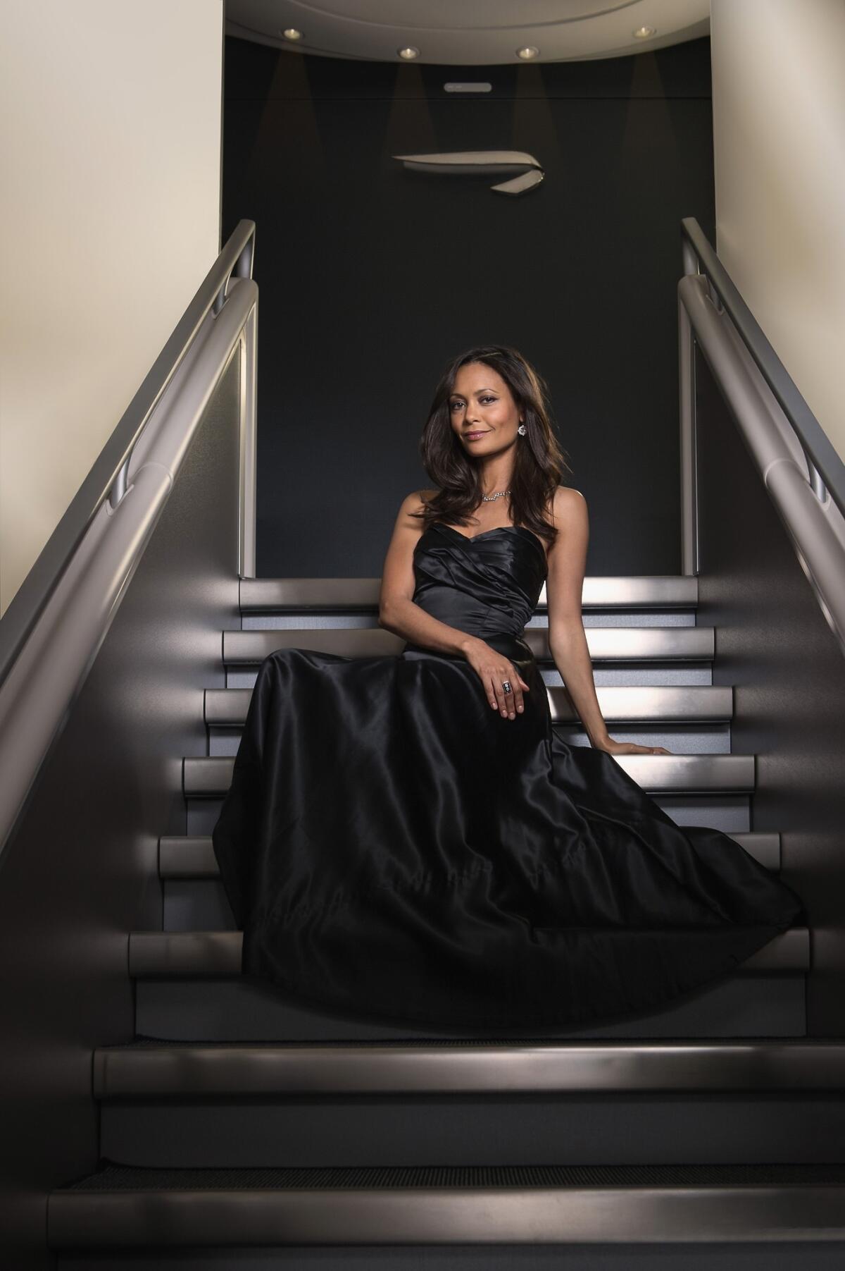 Thandie Newton poses for a promotion for British Airways' new A380 aircraft in July, wearing a vintage gown from "The Gathering Goddess" and jewelry by Solange Azagury-Partridge.