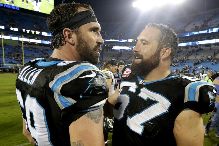 Panthers defensive end Jared Allen (69) and center Ryan Kalil (67) celebrate after a 27-16 victory over the Eagles on Oct. 25.