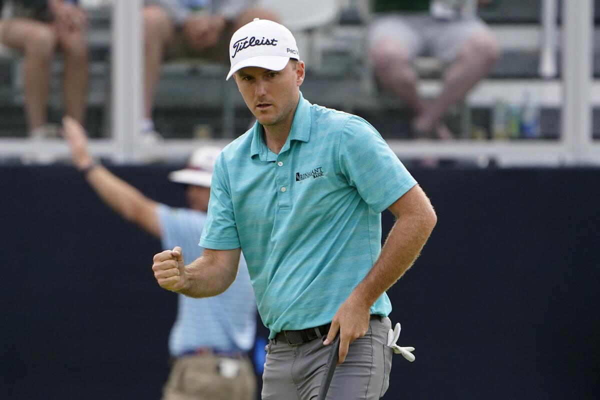 Russell Henley pumps his fist after sinking a putt on No. 18 during the third round of the U.S. Open.