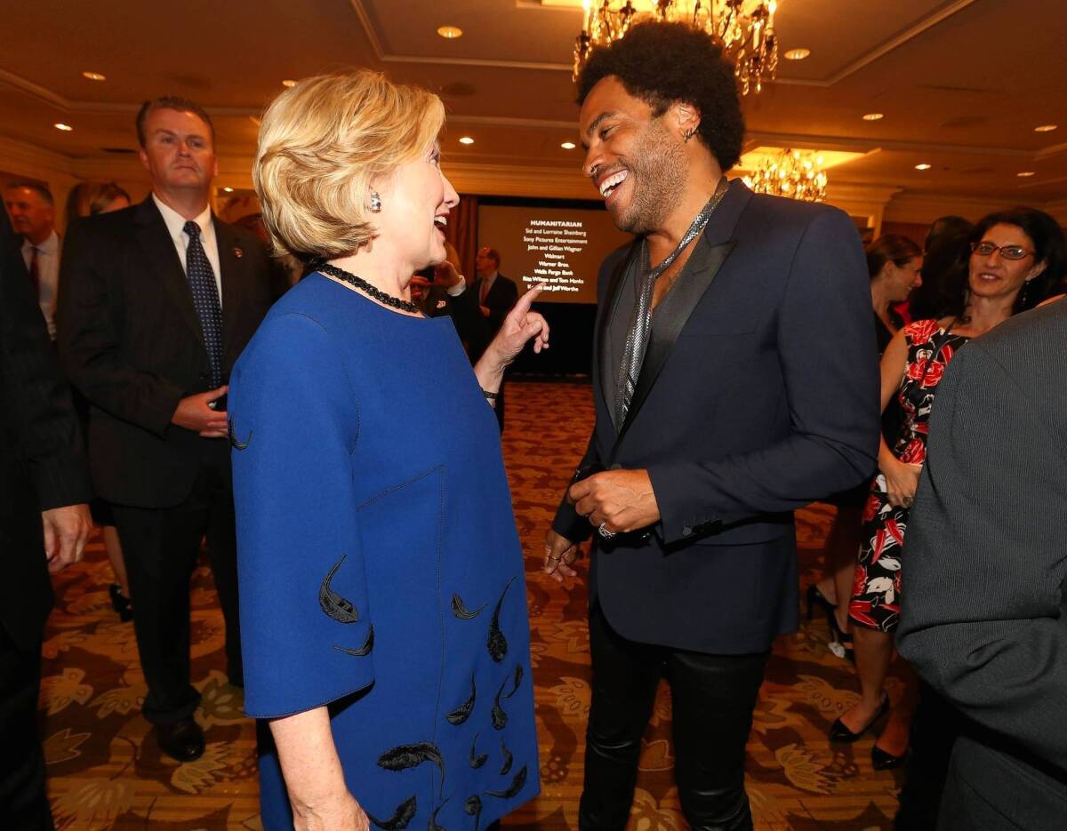 Hillary Rodham Clinton visits with musician Lenny Kravitz at a Beverly Hills event last week.
