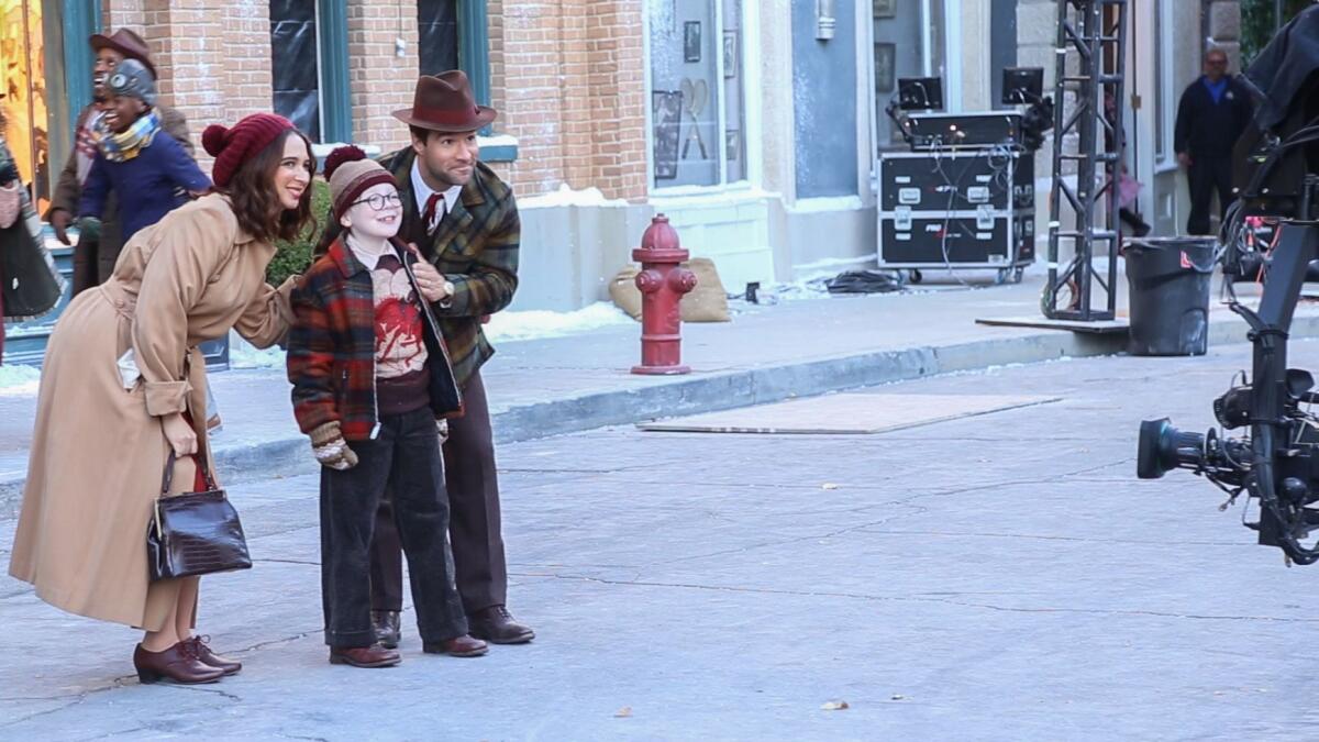 Maya Rudolf (left), "Mother" and Chris Diamantopoulos (right) "The Old Man" stand with Andy Walken "Raplhie Parker" as they rehearse a number from "A Christmas Story Live!"
