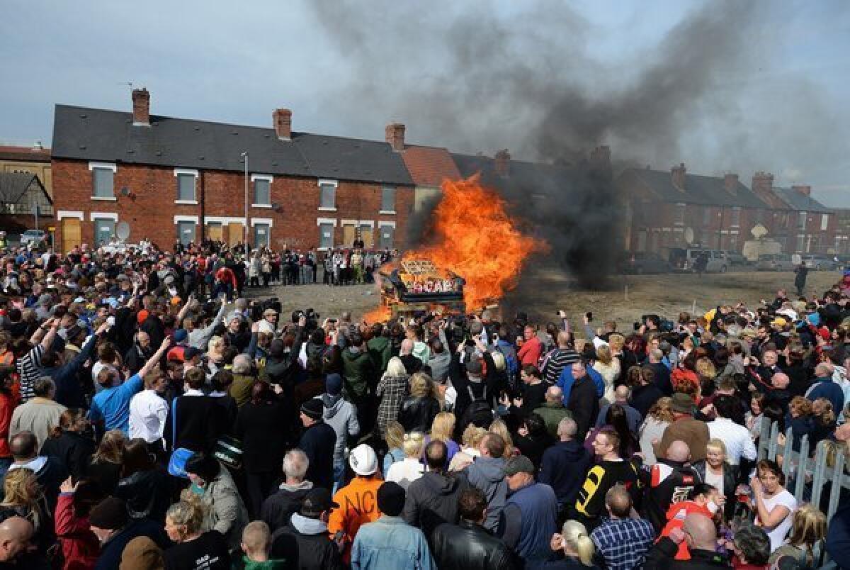 An effigy of the late Margaret Thatcher is burned in northern England on Wednesday as the former British prime minister's funeral is being held in London.