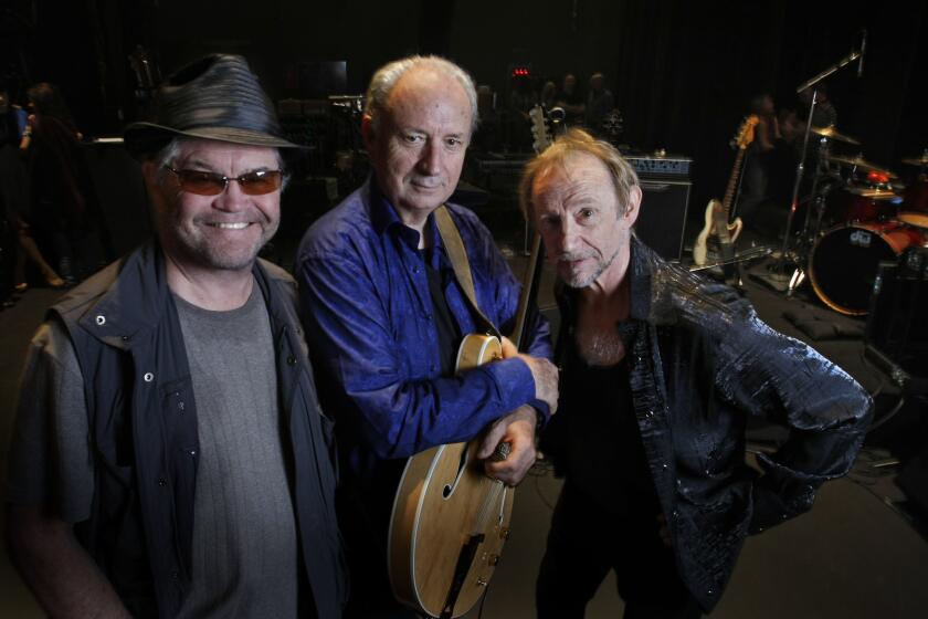 Surviving Monkees band members, from left, Micky Dolenz, Mike Nesmith and Peter Tork, shown in November 2012, will tour more extensively this summer.