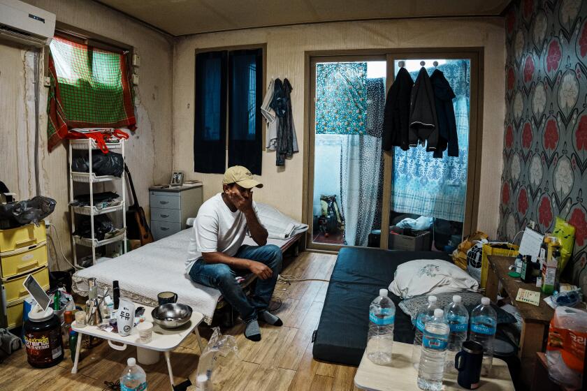 ANSEONG, SOUTH KOREA -- SEPTEMBER 13, 2023: Ajit Roy, 41, lives in a cramped one-room apartment that his former company, Ansung Industrial, uses as a migrant worker dormitory, in Anseong, South Korea, Wednesday, Sept. 13, 2023. Roy is a migrant worker from Bangladesh who worked at a South Korean farming machinery company until 2021, when he developed a rare and incurable lung disease he believes is related to his work grinding and degreasing tractor parts. Unable to work and his debts piling up, he has been waiting for his workers' compensation application to be approved since February 2021. (MARCUS YAM / LOS ANGELES TIMES)