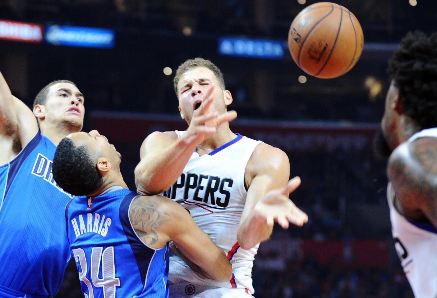 Clippers forward Blake Griffin is called for charging into Mavericks guard Devin Harris in the first half Thursday night at Staples Center.