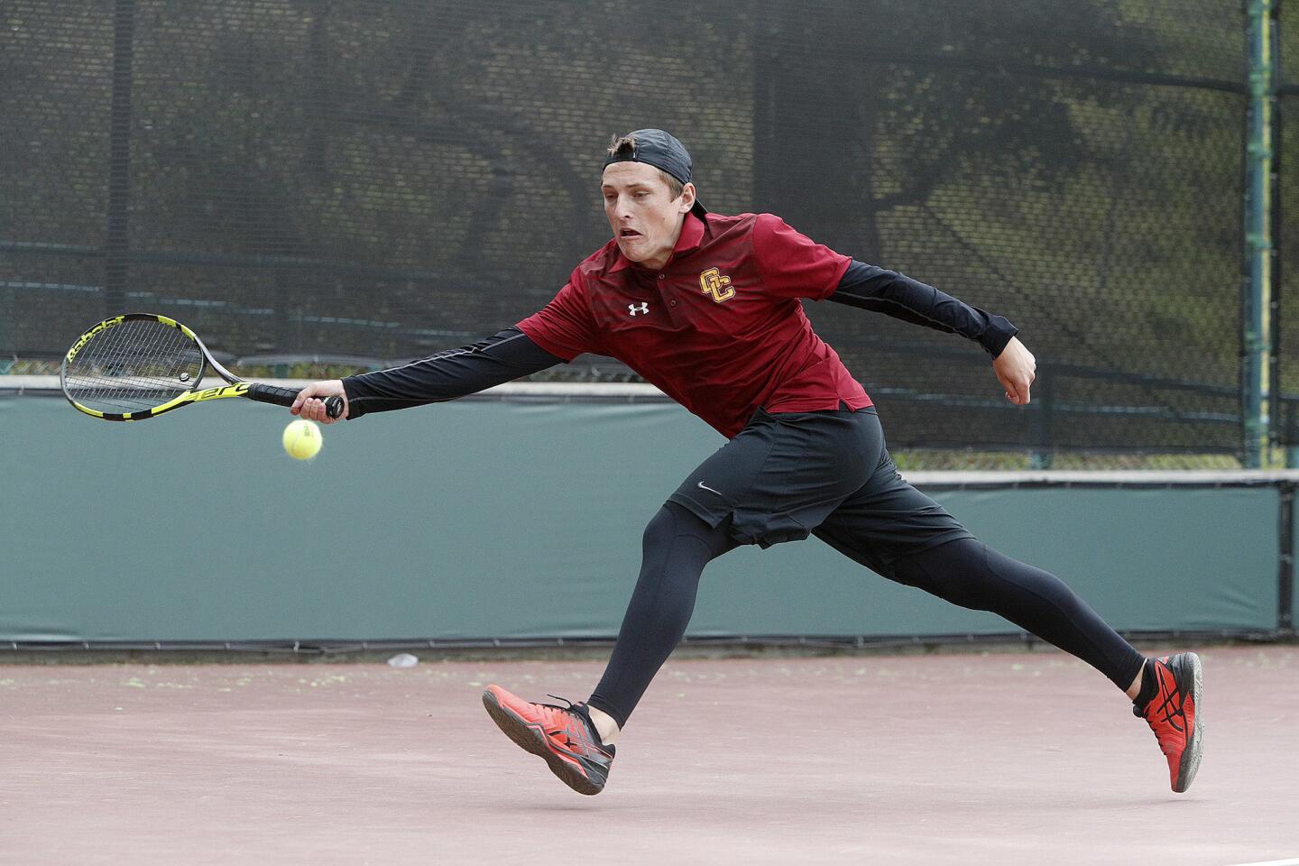 GCCâ€™s Nicholas Pupiec chases a wide shot to return it in a Western State Conference men's tennis match against Santa Barbara City College at Glendale Community College on Tuesday, March 19, 2019.