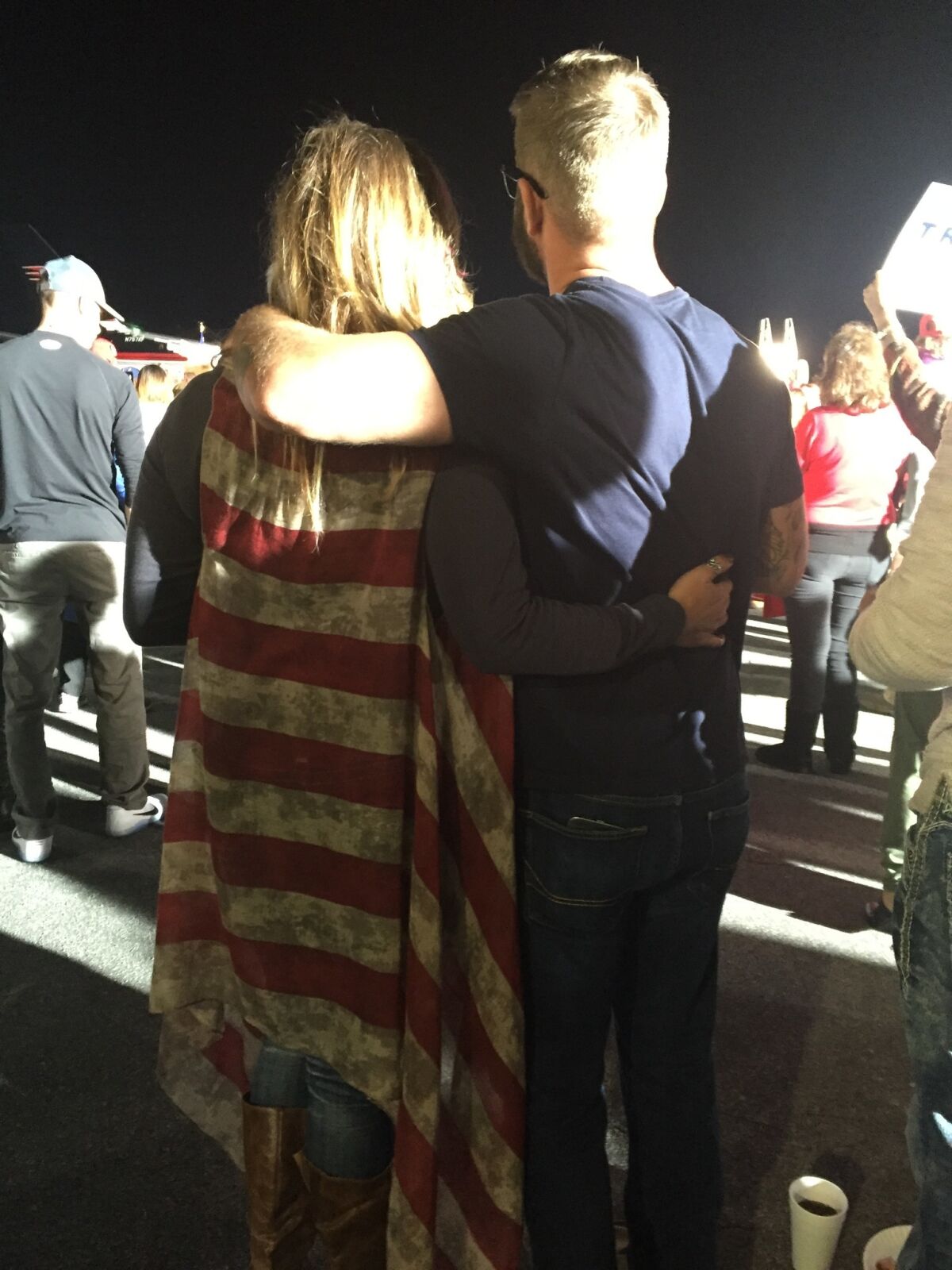 Shauna Godwin, left, wear a flag-themed sweater at a Trump rally in Kinston, N.C. (Lisa Mascaro / Los Angeles Times)