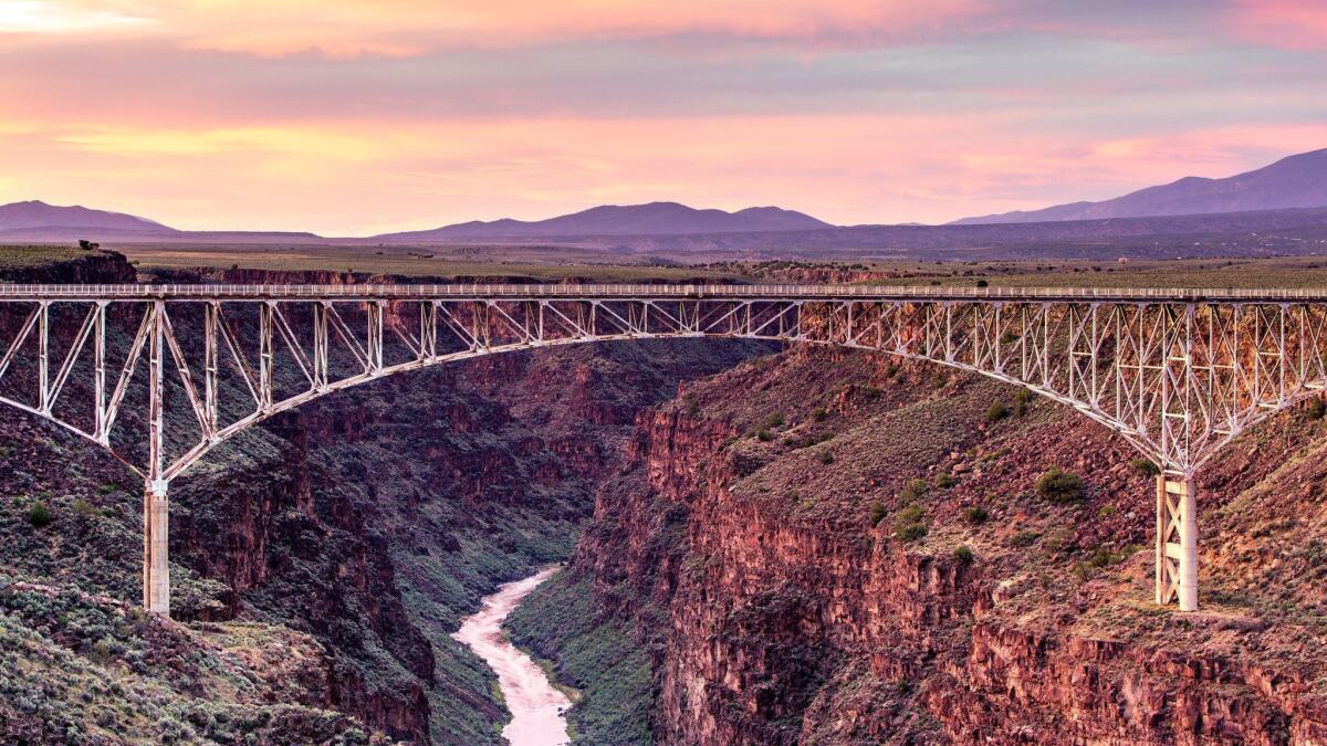 A colorful sky forms the backdrop to the bridge spanning the Rio Grande Gorge near Taos, New Mexico. ** OUTS - ELSENT, FPG, CM - OUTS * NM, PH, VA if sourced by CT, LA or MoD **