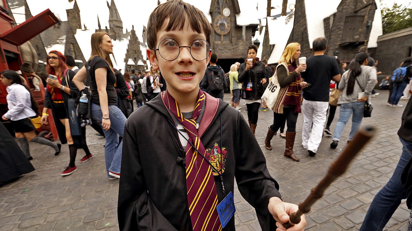 Pacey McWilliams, 10, of Edmonton, Canada, looks the part as he enters the Wizarding World of Harry Potter at Universal Studios Hollywood.