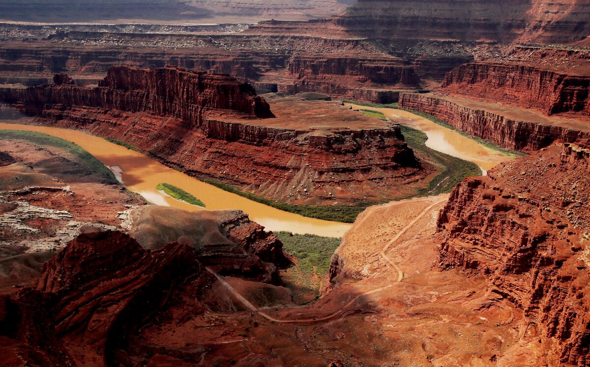 The muddy waters of the Colorado River flow through Utah's Canyonlands National Park.