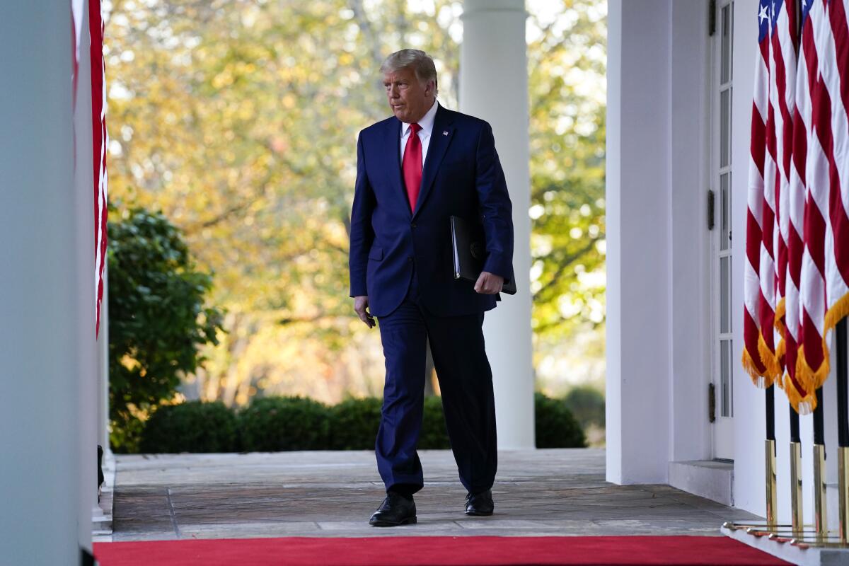 President Trump arrives to speak in the Rose Garden of the White House on Friday.