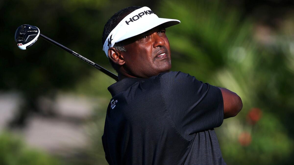 Vijay Singh watches his tee shot at No. 15 during the first round of the Sony Open on Thursday.