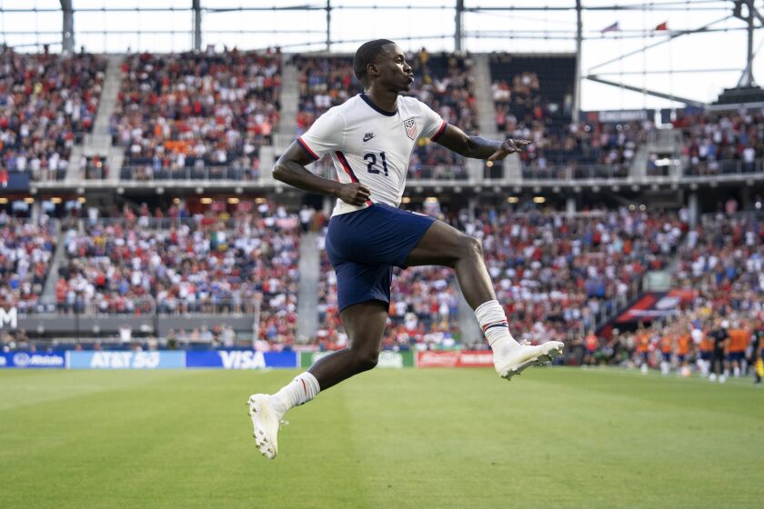 U.S. forward Tim Weah celebrates his goal during the first half of the team's international friendly soccer match against Morocco, Wednesday, June 1, 2022, in Cincinnati. (AP Photo/Jeff Dean)