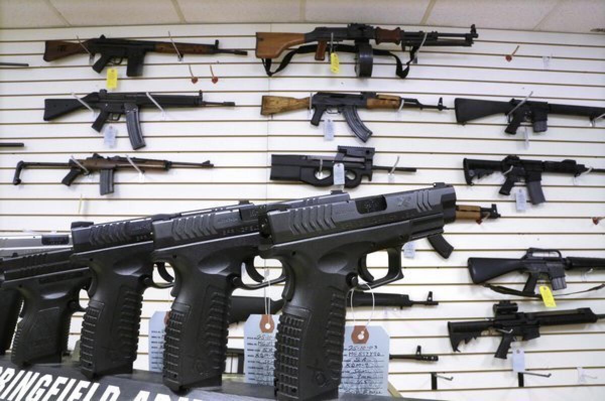Assault weapons and handguns for sale at Capitol City Arms Supply in Springfield, Ill.