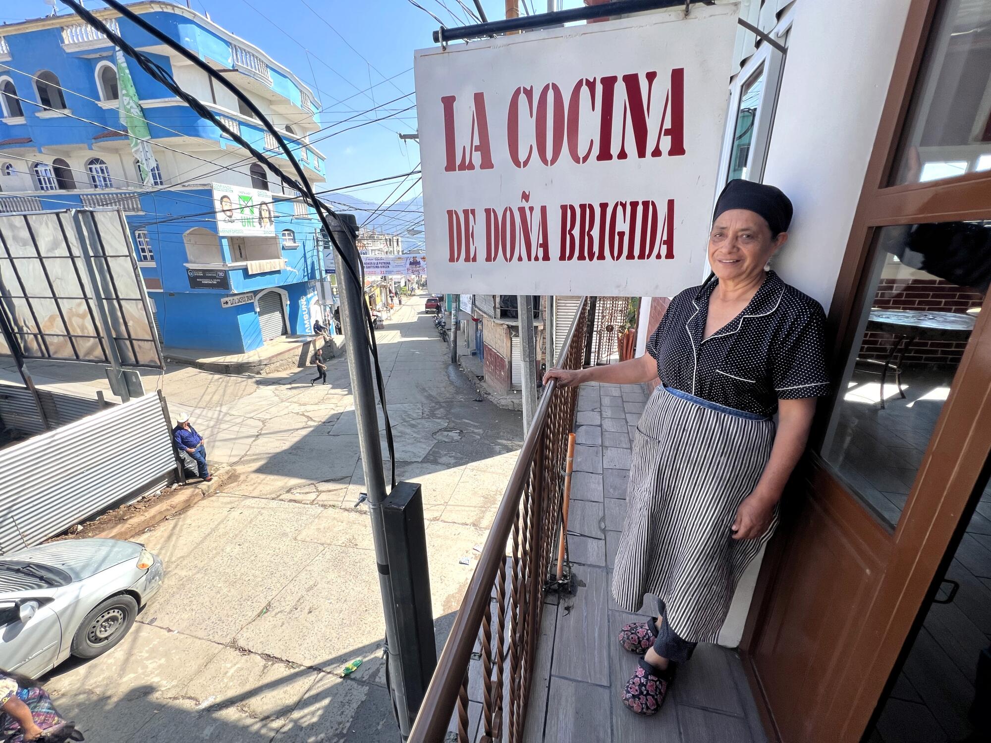 Leticia Miranada stands on the balcony of La Cocina de Dona Brigida, a restaurant her mother started more than 80 