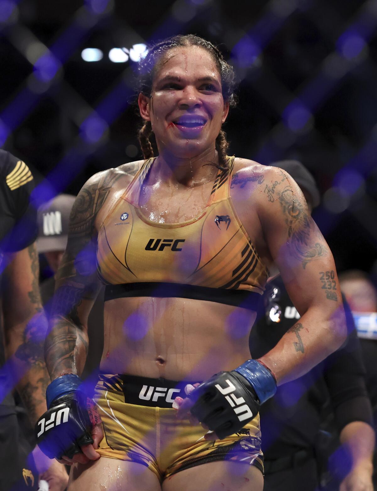 Amanda Nunes stands in the octagon after  