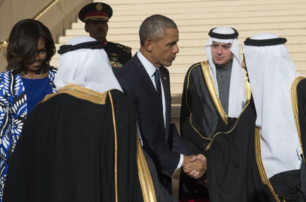 President Obama shakes hands with King Salman, the new ruler of Saudi Arabia, after arriving in Riyadh on Jan. 27.