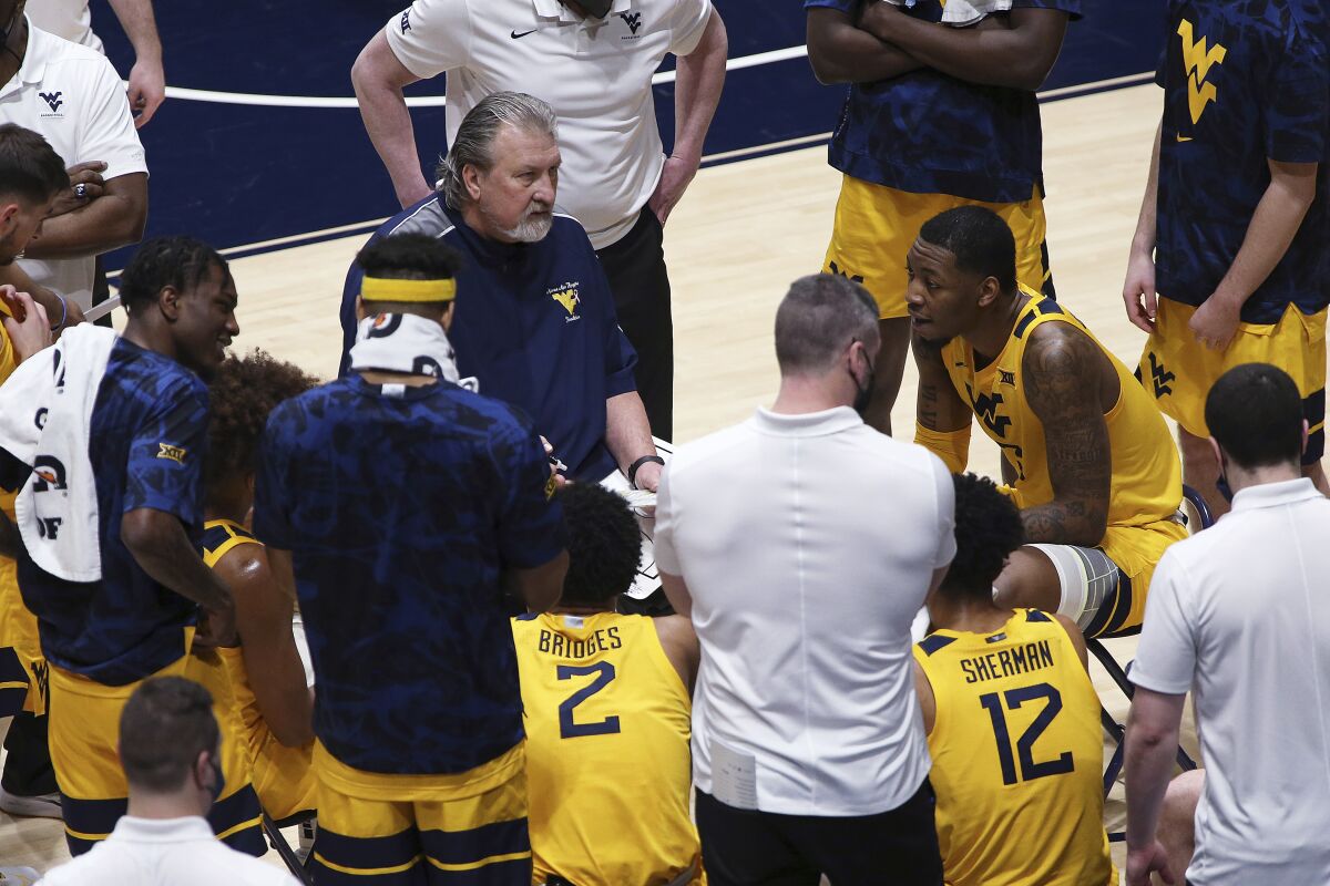 West Virginia coach Bob Huggins speaks with his players during a game against Baylor on March 2.