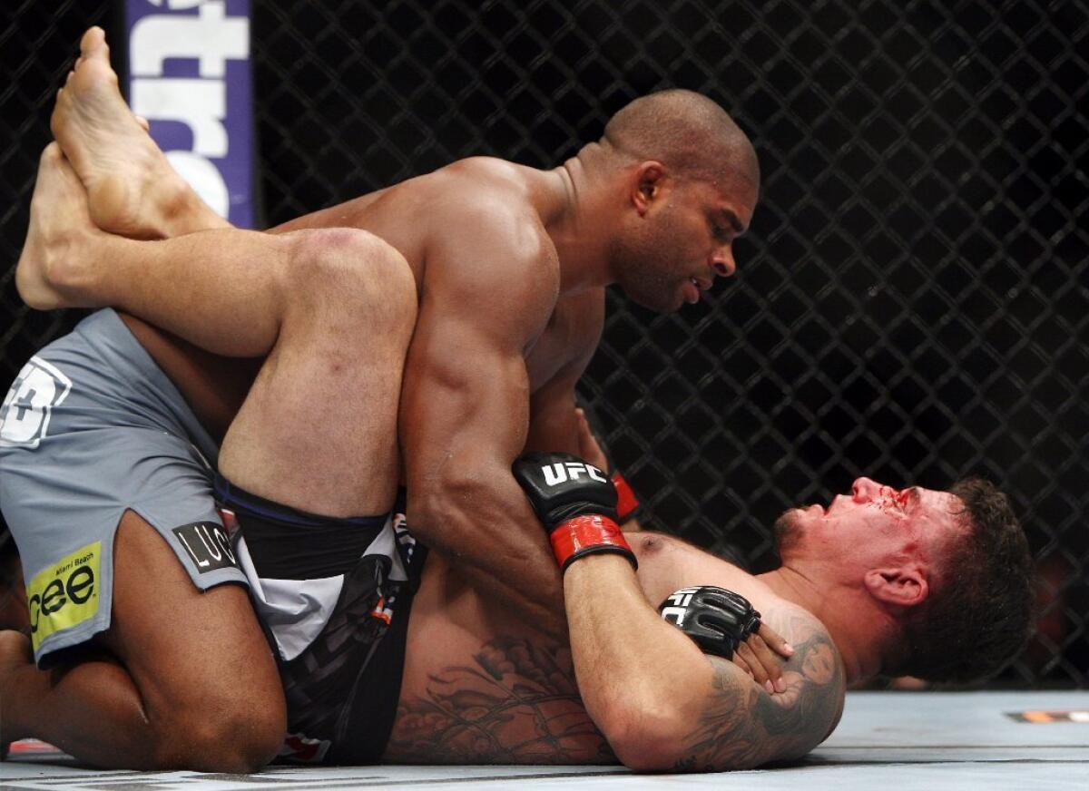 Alistair Overeem, top, put in a workman-like performance in his win over Frank Mir.