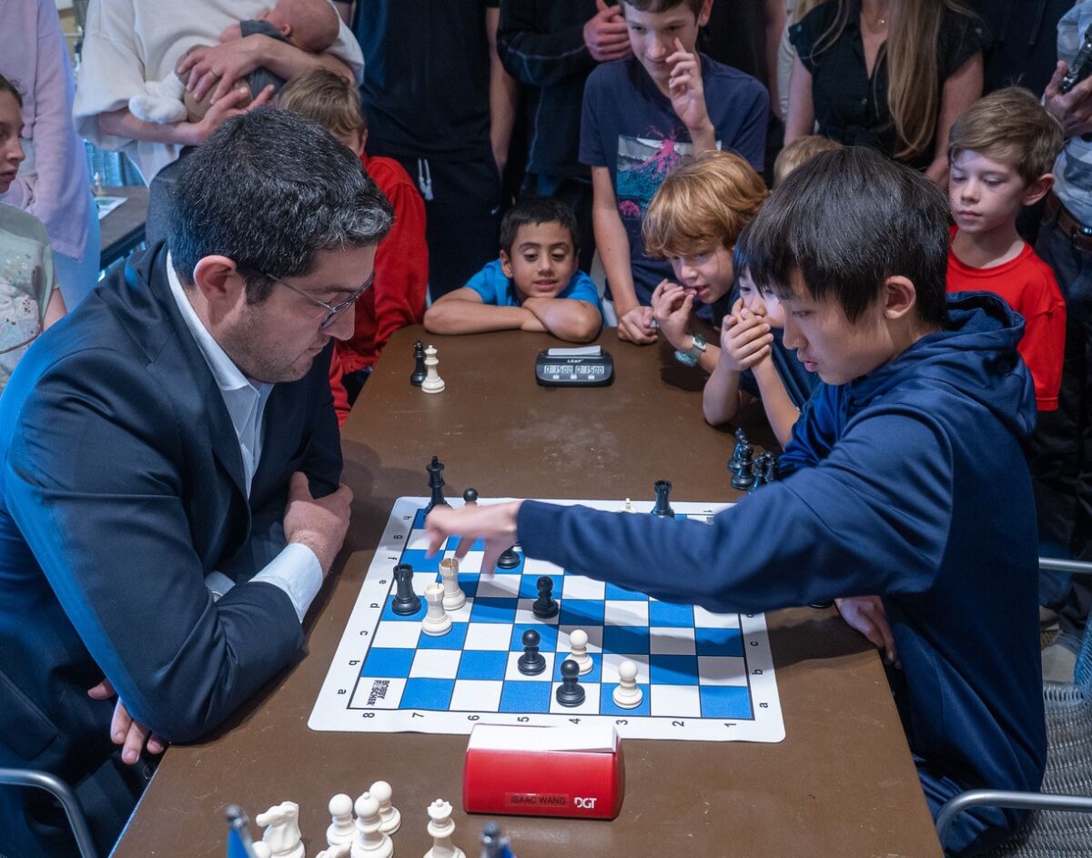 Isaac Wang, 13, plays against chess grandmaster Vasif Durarbayli during a May 18 exhibition at the La Jolla/Riford Library.