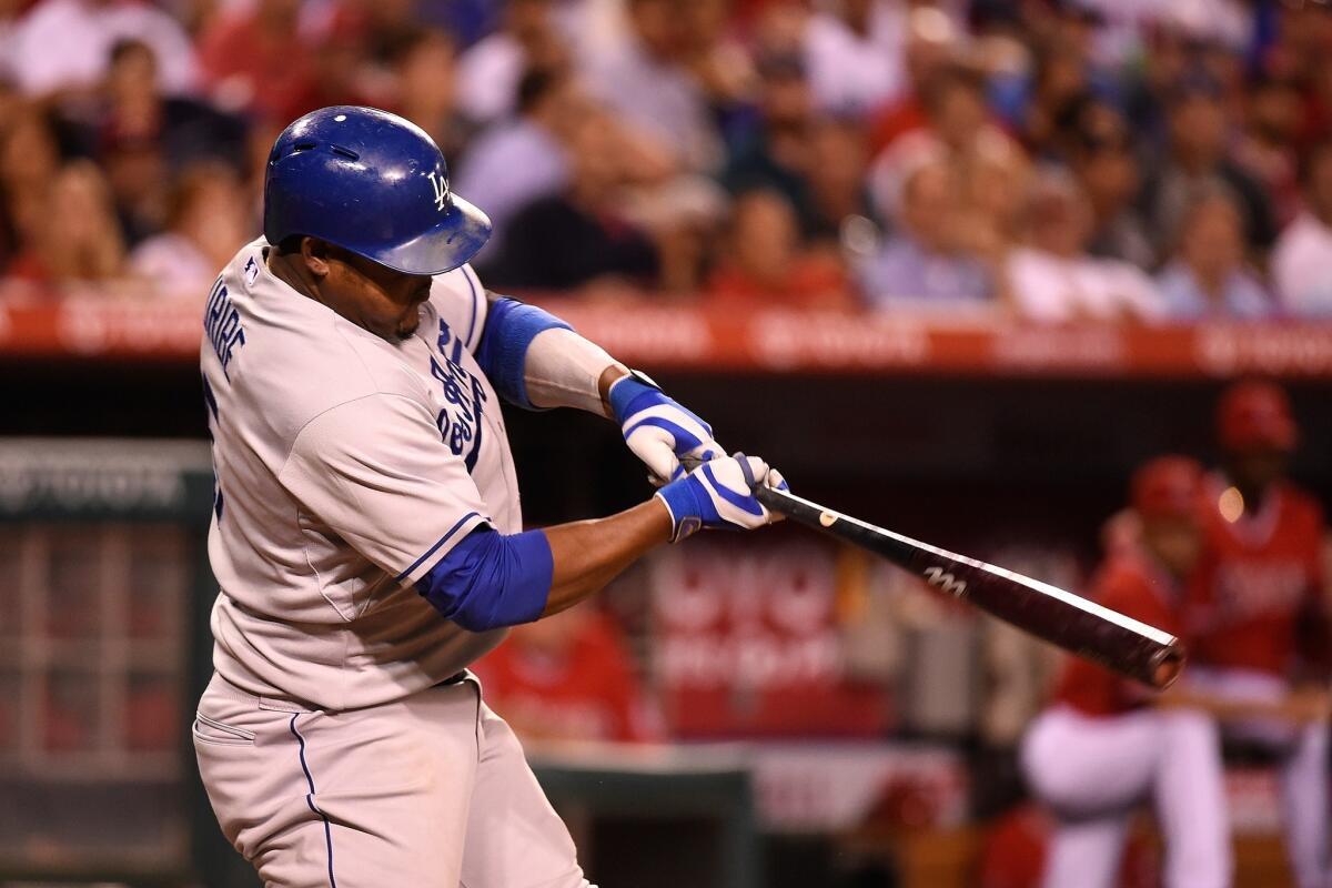 Dodgers third baseman Juan Uribe was pulled from Friday's loss to the Brewers because of tightness in his right hamstring.