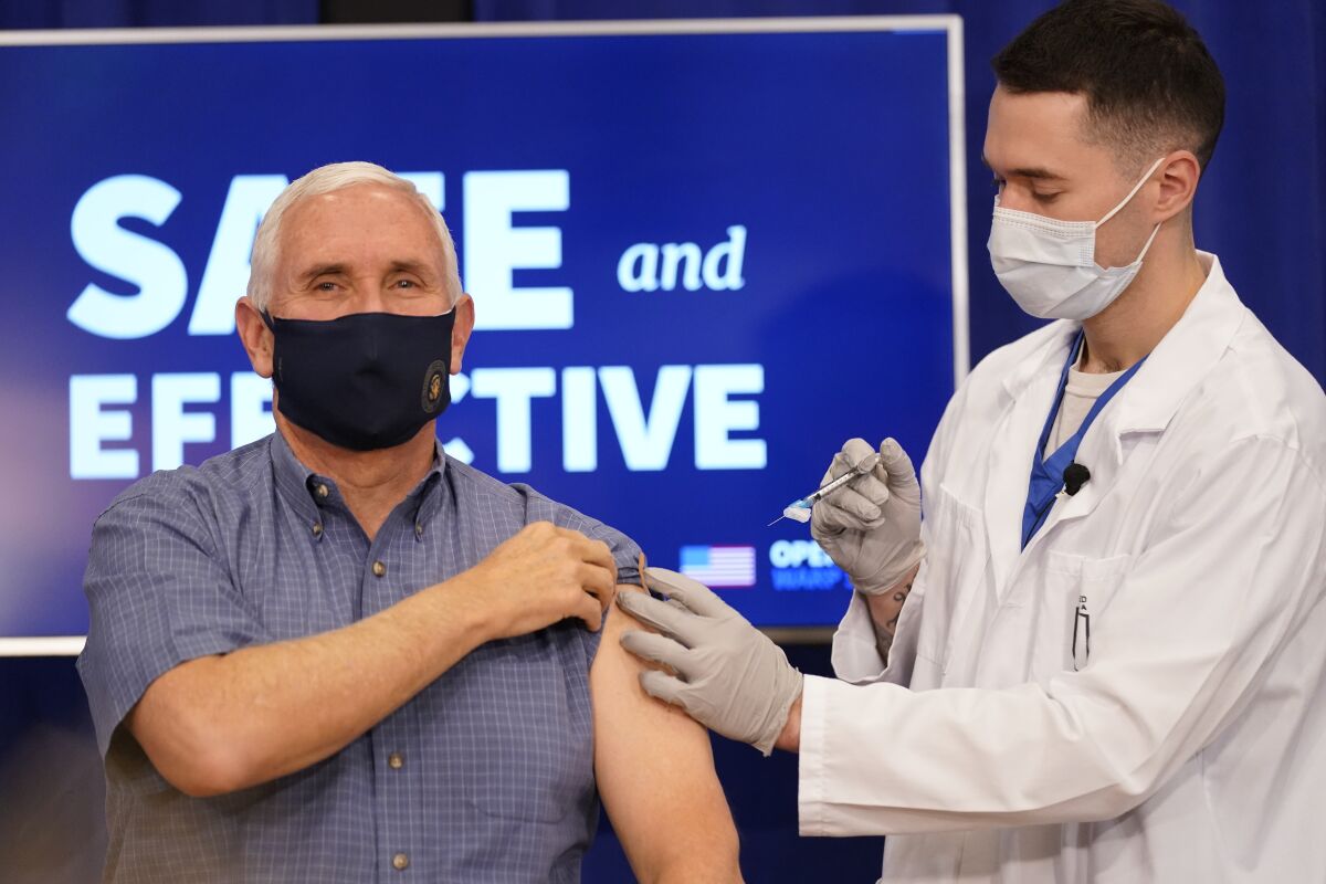 Vice President Mike Pence receives a Pfizer-BioNTech COVID-19 vaccine shot in Washington, D.C., on Friday.